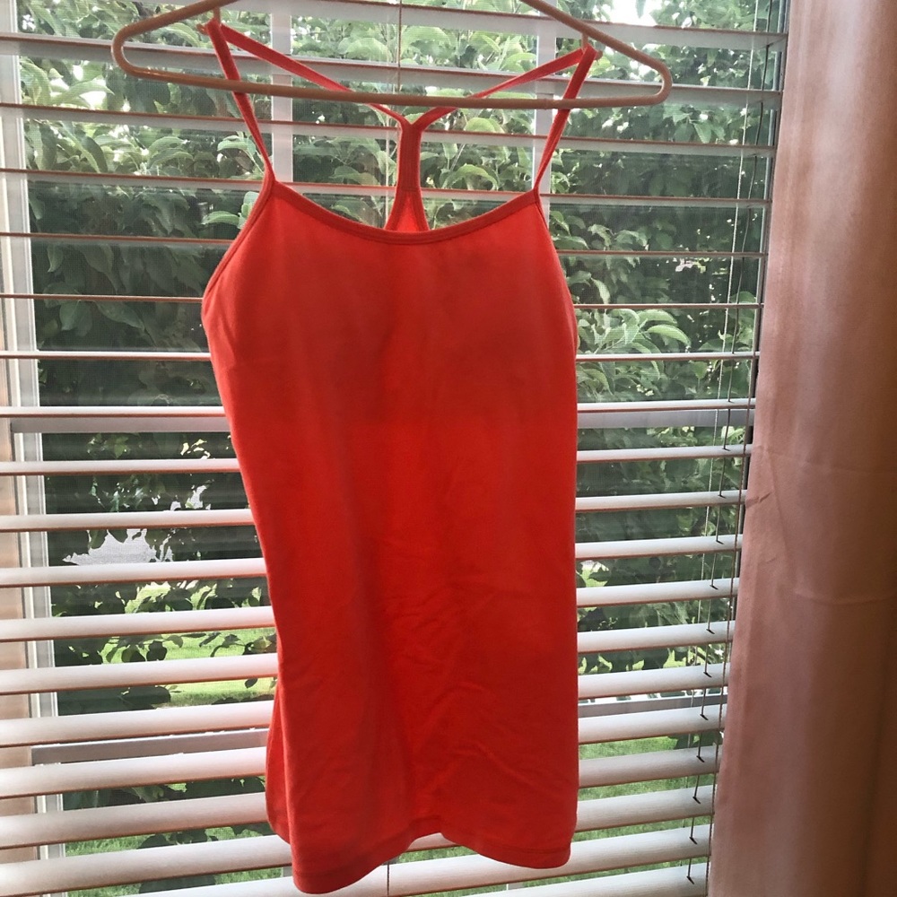 Orange Lululemon racer back workout tank.